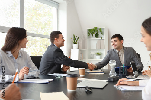 Business colleagues shaking...