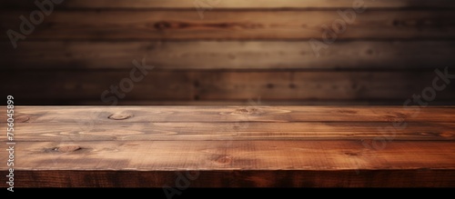A brown hardwood plank table stands in front of a wooden wall  showcasing various tints and shades of wood. The pattern and grain of the lumber create a beautiful aesthetic