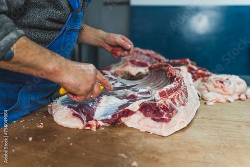 Industrial slaughterhouse worker job. Food industry business concept, man working at the slaughterhouse. High quality photo