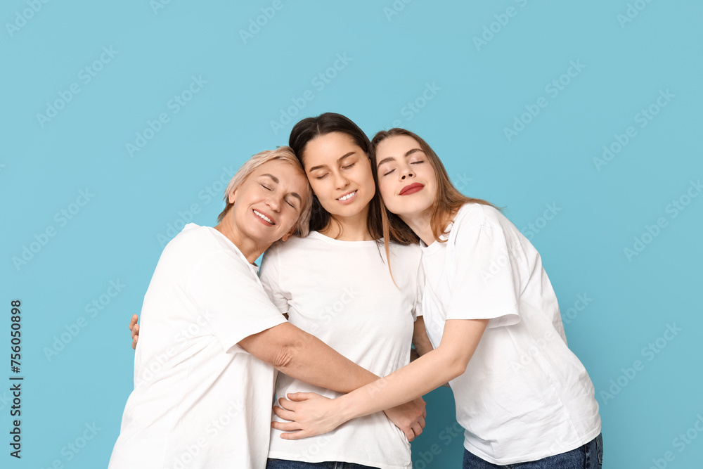 Portrait of hugging women on blue background. Women history month Portrait of hugging women on blue background. Women history month