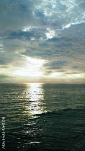 Ocean sunset slow pan with wave