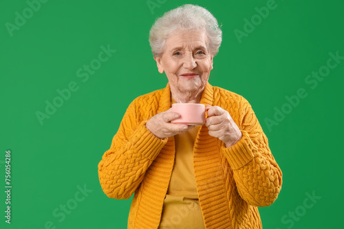 Senior woman with cup of te...