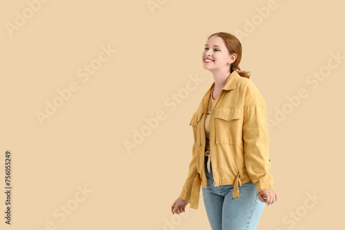 Smiling young redhead woman...
