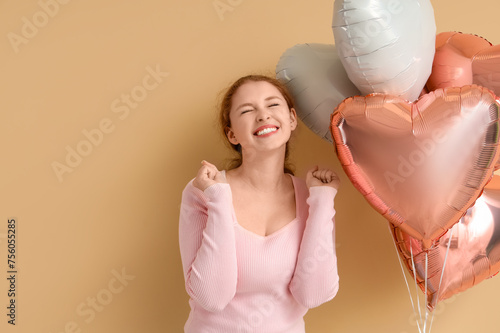 Smiling young redhead woman...