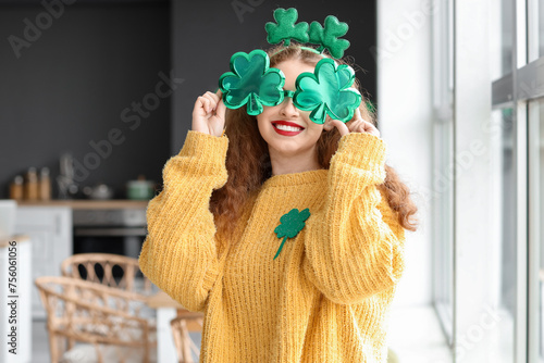 Smiling young woman celebra...