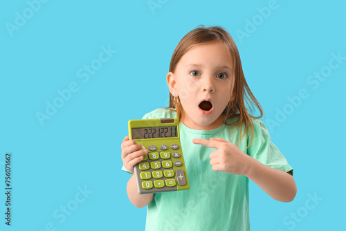 Shocked little girl pointin...
