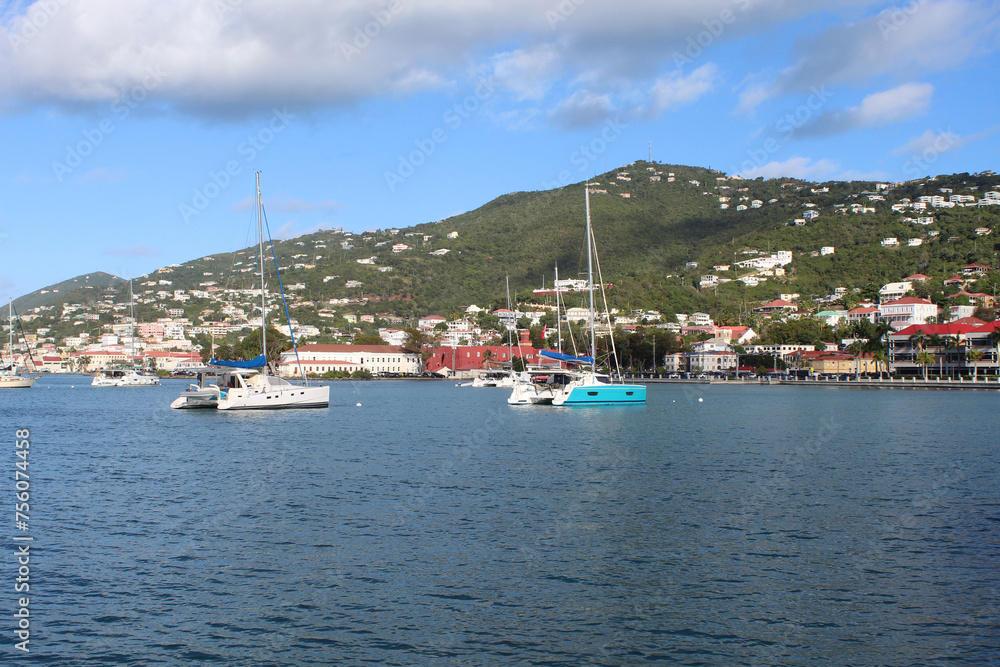 Boats in a harbor at Charlotte Amalie, US Virgin Islands with houses in the background