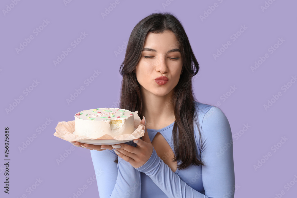 Beautiful young woman with sweet bento cake on lilac background. International Women's Day Beautiful young woman with sweet bento cake on lilac background. International Women's Day
