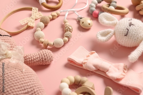 Different baby accessories on pink background, closeup