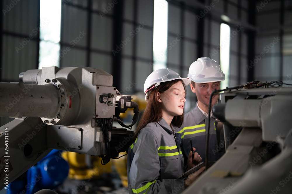 engineers check control heavy machine robot arm. Diverse Team of Industrial Robotics Engineers Gathered Around Machine. Professional Machinery Operators repair electric robot on bright digital panel. engineers check control heavy machine robot arm. Diverse Team of Industrial Robotics Engineers Gathered Around Machine. Professional Machinery Operators repair electric robot on bright digital panel.