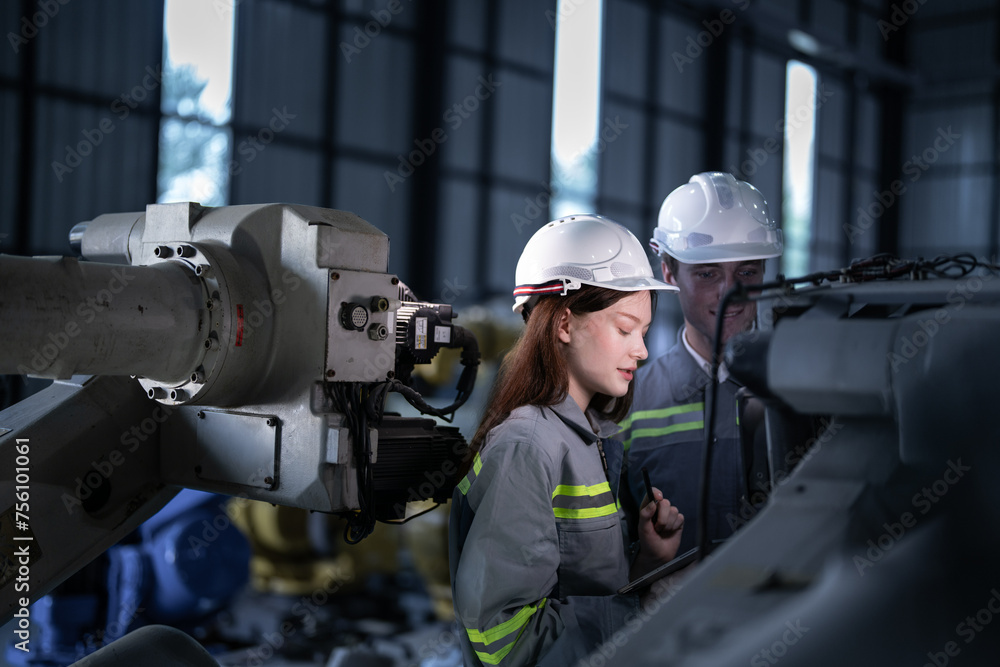 engineers check control heavy machine robot arm. Diverse Team of Industrial Robotics Engineers Gathered Around Machine. Professional Machinery Operators repair electric robot on bright digital panel. engineers check control heavy machine robot arm. Diverse Team of Industrial Robotics Engineers Gathered Around Machine. Professional Machinery Operators repair electric robot on bright digital panel.