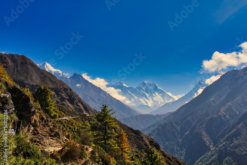 Everest and Lhotse rise like distant dreams over the landscape against a bright blue sky in this heavenly vision from Namche Bazaar