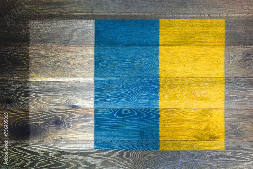 Canary Islands flag on rustic old wood surface background photo
