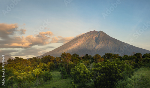 Rural landscape and tropical nature overlooking magnificent sunrise and mount Agung volcano on Bali island, Karangasem district photo