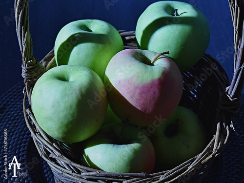 Green granny Smith apples showing the shadows of a wooden basket (ID: 756116866)