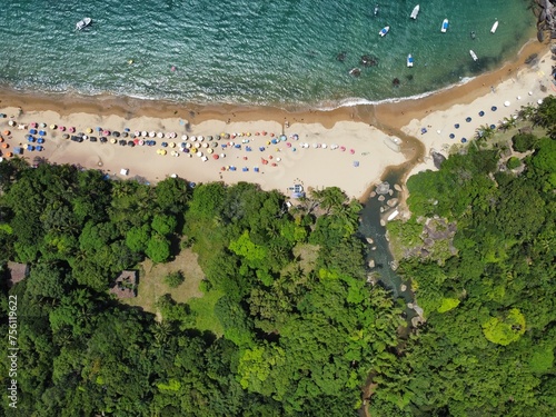 aerial photo of paradisiacal blue beach with clear sand