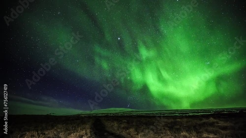 A capture of the swiftly dancing, flickering Northern Lights captured in Iceland. photo