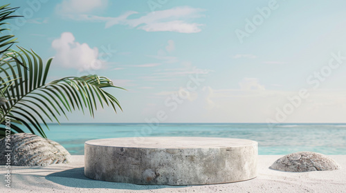 A large stone structure sits on a beach next to a palm tree
