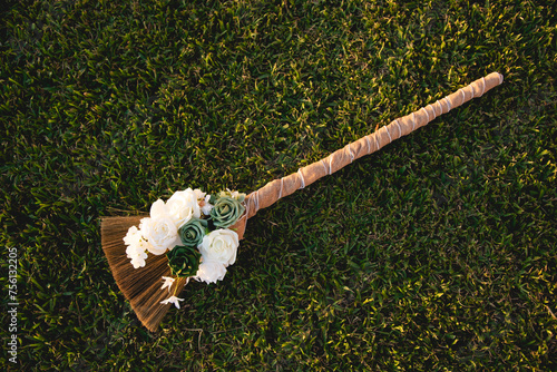 Beautiful traditional broom, Jumping the broom (or jumping the besom) is a phrase and custom relating to a wedding ceremony in which the couple jumps over a broom.