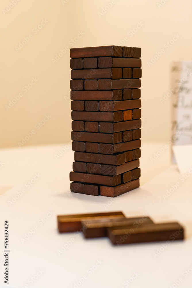 Jenga is a game of physical skill created by British board game designer and author Leslie Scott, The name comes from the Swahili word Jenga is a game of physical skill created by British board game designer and author Leslie Scott, The name comes from the Swahili word