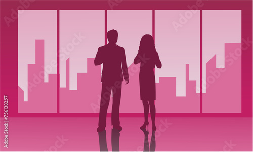 Silhouettes of people one of which is a man and a woman
