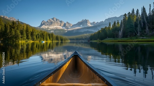 Tranquil Mountain Lake Canoe Adventure at Golden Hour