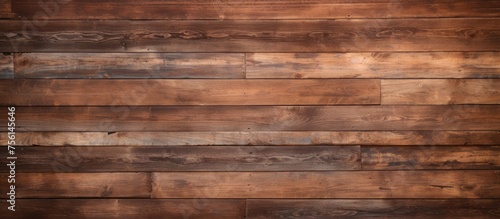 A close up of a hardwood wooden wall with a brown brick pattern, creating a beautiful texture. The blurred background enhances the detail of the brown tints and shades