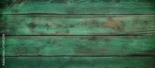 A detailed shot of a rectangular green wooden flooring with electric blue tints. The pattern showcases parallel lines and symmetry, reminiscent of grass blades