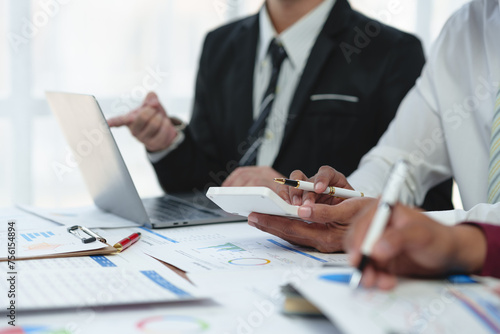 Wallpaper Mural Asian business advisor meeting to analyze and discuss the situation on the financial report in the meeting room. brainstorming, discussing, and analyzing business strategy. Financial advisor concept Torontodigital.ca