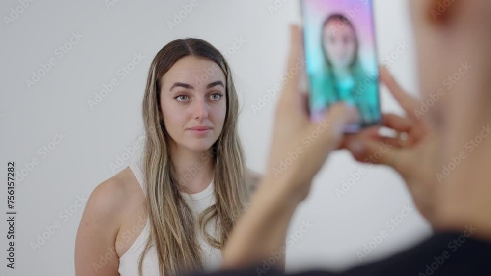 Taking selfie of a girlfriend. picture of before and after of botox facial treatment. beautiful young girl posing for a phone camera selfie. frowning and making faces for face botox injection. Taking selfie of a girlfriend. picture of before and after of botox facial treatment. beautiful young girl posing for a phone camera selfie. frowning and making faces for face botox injection.
