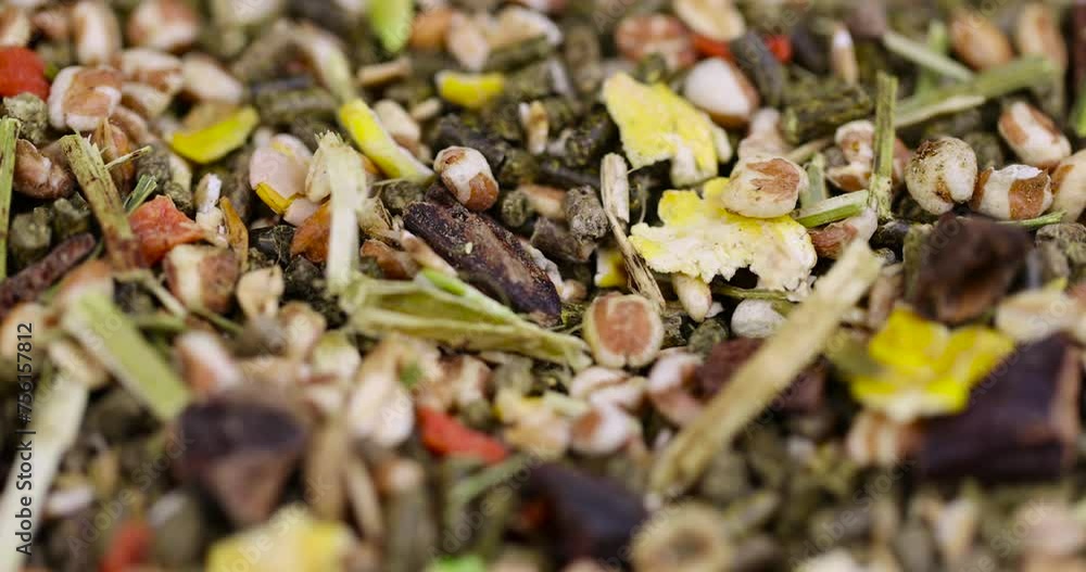 combined feed for rodents from hay, corn, cereals, vegetables, close-up of ingredients mixed for rodents combined feed for rodents from hay, corn, cereals, vegetables, close-up of ingredients mixed for rodents
