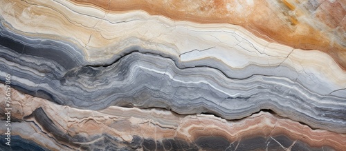An upclose view of a bedrock rock with a marble texture, showcasing the natural materials intricate pattern. The landscape features a unique blend of woodlike swirls and veins