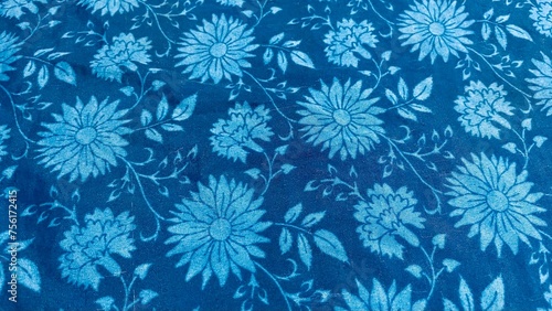 Brightly colored fabrics have blue and blue patterns, floral prints, textiles, bright patterns.