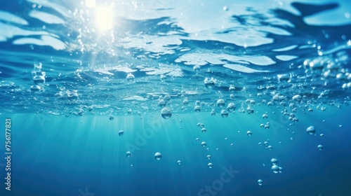Blue waves and bubbles underwater Underwater blue ocean background in the sea Underwater view of the sea surface