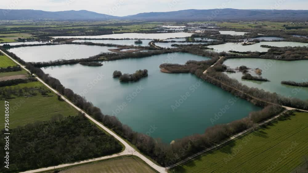 Partitoned body of water by walking path roads by farm fields in ancient Antela lagoon Areeiras da Limia in Xinzo de Limia Ourense Partitoned body of water by walking path roads by farm fields in ancient Antela lagoon Areeiras da Limia in Xinzo de Limia Ourense