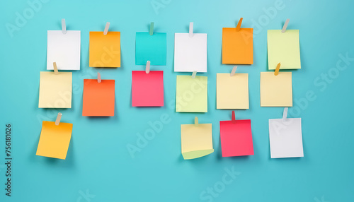 A wall covered in colorful sticky notes with a blue background photo