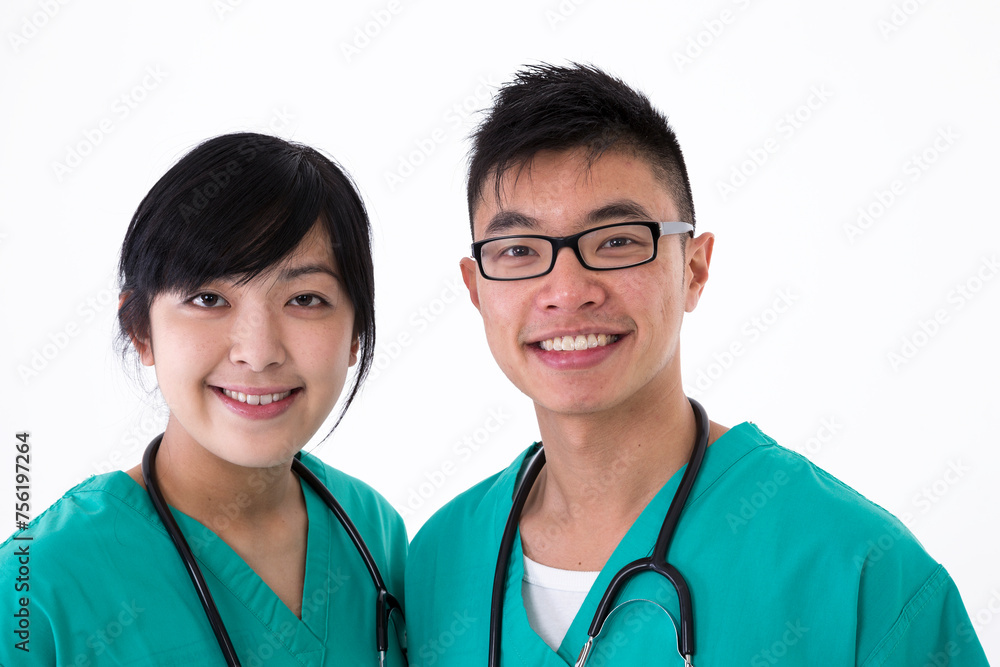 Asian healthcare workers wearing medical scrubs. Asian healthcare workers wearing medical scrubs.