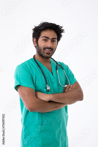 Male Indian doctor wearing a Green Scrubs.