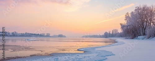 Winter landscape at sunset in snow covered forest and river © rizky