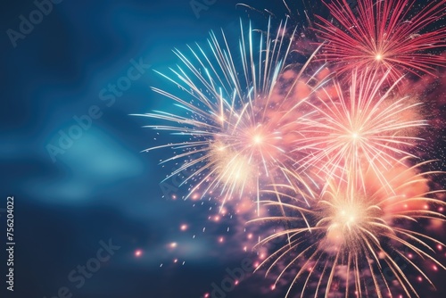 Fireworks display in sky with blue background