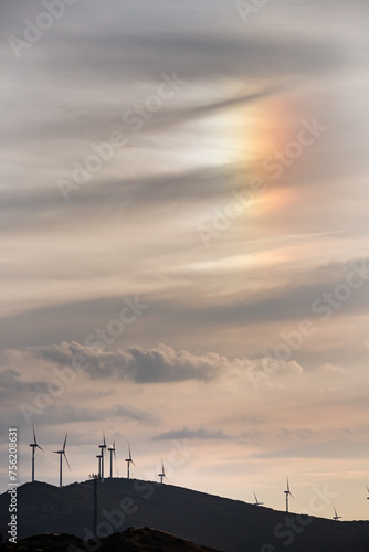 Iridescent clouds over windmills in the Alhambra