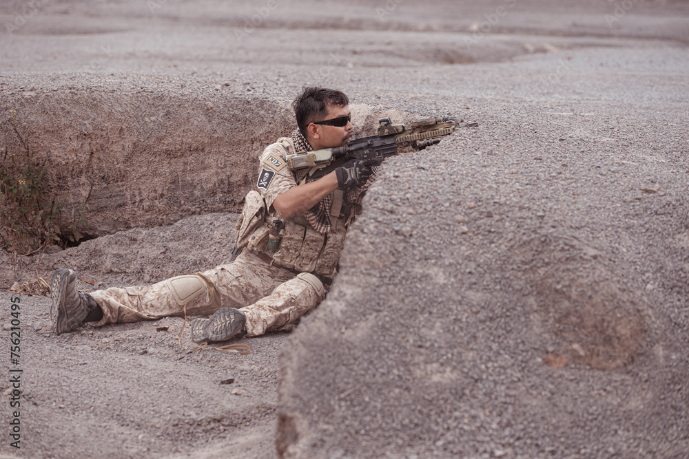 Fototapeta premium Soldiers in camouflage military uniforms carrying weapons, Reconnaissance missions in rugged mountains, Assault infantry battle training.
