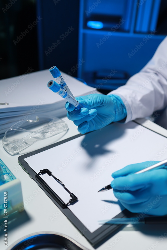 A researcher is taking notes. It is being developed in the lab as a profile for other researchers, A biological chemical scientist is writing a report on his day's work for a boss. A researcher is taking notes. It is being developed in the lab as a profile for other researchers, A biological chemical scientist is writing a report on his day's work for a boss.