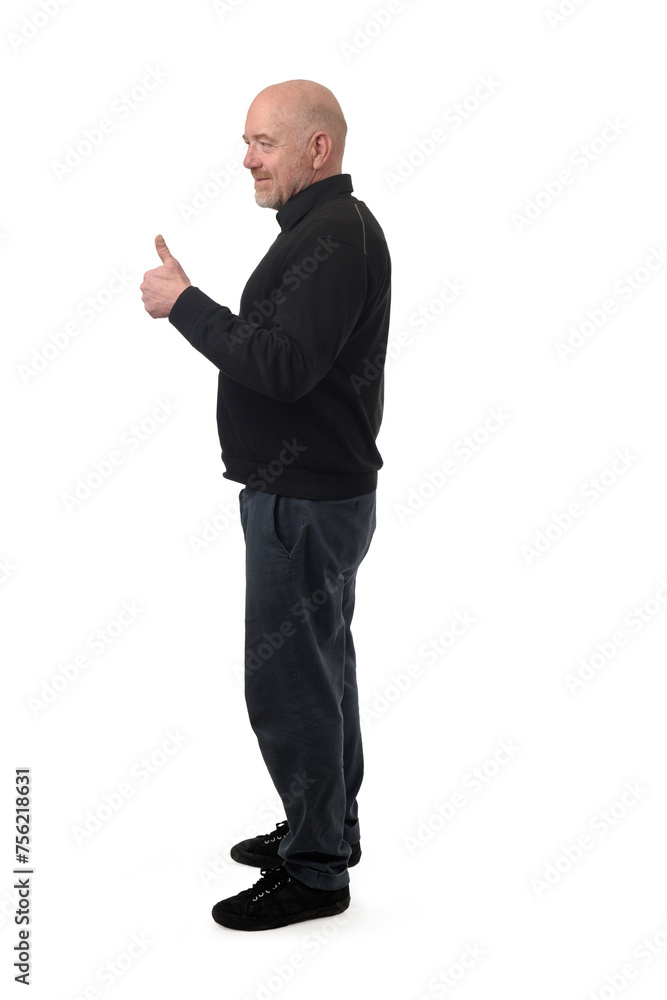 side view of a man showing thumbs up sign on white background. side view of a man showing thumbs up sign on white background.