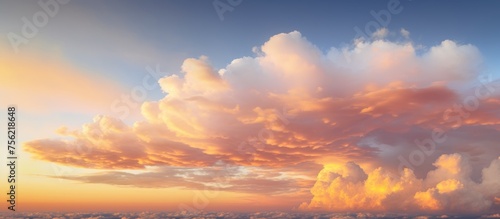 A cumulus cloud drifts through the sky during sunset  creating a beautiful afterglow of red and orange hues in the atmosphere