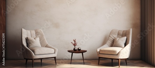 Modern armchairs interior design on a neutral wall photo