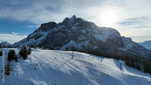 Civetta resort. Panoramic view of the Dolomites mountains in winter, Italy. Ski resort in Dolomites, Italy. Aerial drone view of ski slopes and mountains in dolomites. photo