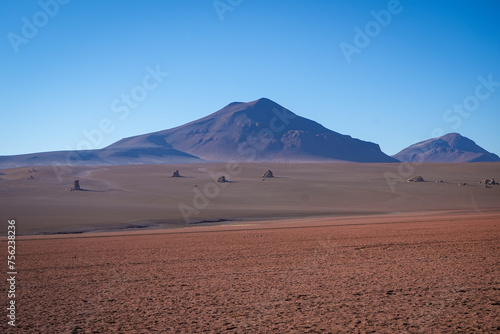 Dramatic Red Sand Desert with Distant Mountain - Salar de Uyuni, Bolivia 