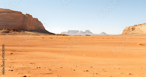 an empty dirt plain with desert rock and sparse ground