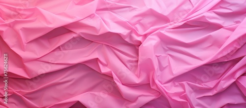 A closeup of a piece of pink fabric resembling a petal from the rose family, with shades of violet, magenta, and purple. The fabric has a floral pattern and could be used for linens or a sleeve